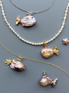 Check out our pearl fish pendants - each pendant is unique. The pendant features a lustrous baroque pearl that forms the body of a whimsical fish. The fins and tails are crafted from gold-tone metal, adding a touch of luxury to this charming piece. These pearl fish pendants are perfect for adding an elegant yet playful touch and enchantment to any piece of jewelry. Whether you're dressing up for a special occasion or adding a touch of glamour to your everyday look, these pendants are the perfect Funky Pearl Jewelry, Beaded Necklace With Charm, Pearl Necklace Stack, One Piece Jewelry, Pearl Jewlery, Beaded Fish, Baroque Pearls Jewelry, Whimsical Fish, Handmade Pearl Jewelry