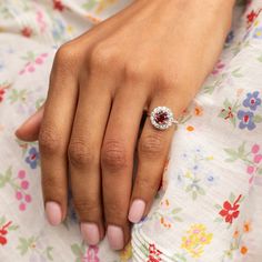 The Story A timeless cluster ring with a striking stone at center. Sitting at the center of this piece is a richly colored spinel weighing approximately 1.17 carats. The vintage cut stone is saturated in a red hue. Prong set, it's surrounded by a halo of 13 chunky Old Mine cut diamonds, weighing 0.04 to 0.05 carats each, giving the ring a total diamond weight of approximately 0.59 carats. The setting, from circa 1905, was beautifully paired with the vintage cut spinel which was added at a later date. The center spinel makes it pop with color. It looks amazing on the hand with its universally flattering shape and size. We love it on its own or paired with other favorite pieces. It would make a fantastic engagement ring for someone looking for a unique and colorful piece. The Specs Style Num Heirloom Style Emerald Cut Gemstone Halo Ring, Ruby Ring With Diamond Cluster And Brilliant Cut, Cluster Ruby Ring With Brilliant Cut Diamonds, Luxury Ruby Cluster Ring With Center Stone, Luxury Cluster Ruby Ring With Center Stone, Cluster Diamond Gemstones For Wedding, Classic Cluster Ruby Ring, Classic Cluster Ruby Ring With Center Stone, Classic Ruby Cluster Ring With Center Stone