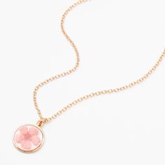 Flowers offer a touch of timeless beauty! This perfect bloom is encased in a clear round pendant that hangs from a matching gold-tone chain. Finish: Gold-tone Length: 16" + 3" extender Closure: Lobster clasp Material: Metal - Claire's Gold Framed Flower Pendant Necklace - Pink Rose Gold Flower Necklace With Round Pendant, Mother's Day Flower Necklace With Round Pendant, Adjustable Flower Charm Necklace, Rose Gold Birth Flower Round Pendant Necklace, Rose Gold Flower Necklace With Round Pendant For Birth, Rose Gold Round Necklace With Flower Charm, Rose Gold Flower Necklace With Adjustable Chain, Delicate Rose Gold Flower Necklace With Adjustable Chain, Adjustable Rose Gold Flower Pendant Necklace