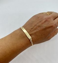 "10k SOLID GOLD WOMEN'S Cuban link ID BRACELET  width: 3.5mm  choice of length: 7\", 8\"  These bracelets are made with 10K gold in a Cuban link style. Cuban bracelets are specially known for their shine and strength. The bracelets have a lobster lock.  The ID bracelet is 6.5mm x 30.6mm. The bracelet links are 3.5mm in width. The approximate weight of the 8\" bracelet is 5.1 grams. The bracelets are marked 10k for metal authenticity. Now offered at an unbeatable price.  Very solid Free Laser eng Classic Name Bracelet With Curb Chain As A Gift, Classic 14k Gold Personalized Chain Bracelet, Classic Personalized 14k Gold Chain Bracelet, Classic 14k Gold Name Bracelet, Classic Gold Bracelet With Name For Anniversary, Classic Gold Name Bracelet For Anniversary, Classic Rectangular Name Bracelet, Tarnish Resistant, Classic Yellow Gold Name Bracelet, Classic Tarnish Resistant Name Bracelet