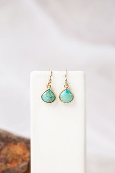 Teardrop shaped turquoise bezels are eye-catching. Short in stature, but not short on style, these beautiful gold bezel settings with gold filled ear wires are an AVD favorite for a reason. Gold Filled (Lead & Nickel Free) Turquoise 1", with gold filled ear wires We hand select our natural materials, thus there may be slight variations in color and/or size that will not detract from the overall aesthetic. Our unique handcrafted designer jewelry for women is made in America, each design created i Floyd Va, Silver Gold Earrings, Silver Gold Necklace, Turquoise Earring, Turquoise Statement Necklace, Designer Handmade Jewellery, Unique Jewelry Designs, Handcrafted Necklace, Large Earrings