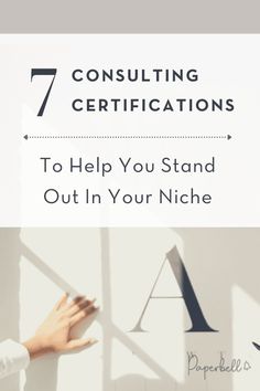 a woman's hand on top of a white wall with the words 7 consulting certificates to help you stand out in your niche