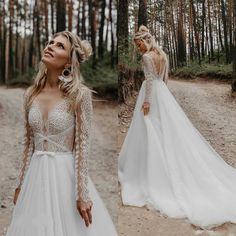 a woman in a white wedding dress standing on a dirt road with trees behind her