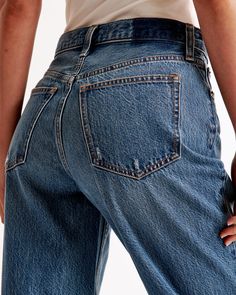 Step into the nostalgia of the early 2000s with Abercrombie & Fitch's Women's High Rise Loose Jeans. These jeans are a modern twist on a classic style, perfect for those who value both comfort and fashion.

- Size: 30 X-SHORT
- Color: Dark with Raw Hem
- Material: Body - Cotton, Lyocell; Pocket Bag - Various materials
- Gender: Female
- Fit: High rise (10.5” rise), relaxed at the waist and hips, loose full-length leg
- Features: Lightweight rigid denim, super soft authentic cotton fabric with no Everyday Distressed Cropped Leg Bottoms, Everyday Distressed Cropped Bottoms, Classic Denim Blue Flare Jeans With Frayed Hem, Classic Flare Jeans In Denim Blue With Frayed Hem, Classic High Rise Medium Wash Bottoms, Classic Dark Wash Cropped Jeans, Classic High-waisted Dark Wash Cropped Jeans, Distressed Dark Wash Cropped Jeans In Rigid Denim, Classic Medium Wash Rigid Denim Bottoms