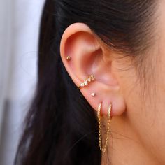 Our tiny diamond earring is perfect for any occasion. It's small size and minimal style makes it perfect as an everyday essential! Wear these studs for your cartilage or earlobe piecing, wear them alone or wear them as an earring stack! Our tiny diamond earring is shipped in a high-quality jewelry bag for storage. SHIPS 1-2 DAYS **Details -A thick layer of 14k Gold layered on .925 sterling silver + e-coat (anti-tarnish) -Clear CZ Stones -Stud size: 2mm -Comes in a pair -Post backs -Hypoallergen: Dainty Huggie Earrings For Gift, Dainty Single Ear Climber For Parties, Dainty Tiny Ear Climbers For Everyday, Dainty Ear Climbers For Everyday, Dainty Huggie Ear Climbers For Gift, Dainty Huggie Ear Climbers As Gift, Dainty Pierced Ear Climbers As A Gift, Dainty Ear Climbers For Party, Dainty Ear Climbers For Parties