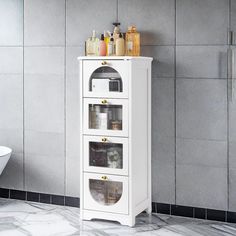 a bathroom with a white cabinet and marble floor