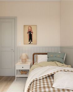 a bedroom with a bed, nightstand and painting on the wall