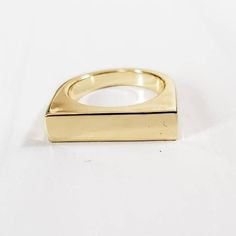 This ring is everything! The 90s are back and so is this gold plated brass flat top ring.  It's a trendy and fun 18k gold plated brass ring blank perfect for jewelry making either by engraving or stamping.  About the item: * The ring blank is shiny and heavy. * The flat top measures 5mm x 20mm and can fit a decent amount of text. Modern Gold Brass Signet Ring, Gold Brass Signet Ring For Everyday, Everyday Gold Brass Midi Rings, Gold Rectangular Metal Rings, Everyday Gold Stackable Brass Rings, Gold Open Ring For Everyday Wear, Gold Open Ring For Everyday, Minimalist Gold Signet Ring In Brass, Minimalist Gold Brass Signet Ring