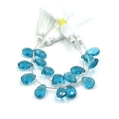 a necklace with blue glass beads on it