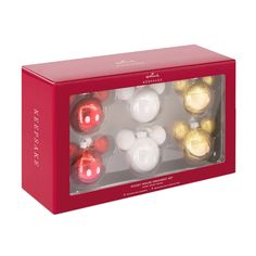 a red box filled with assorted christmas ornaments