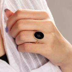 "\"Vintage Black Onyx Ring - Exquisite Black Onyx Ring\" Elevate your style with this extraordinary Black Onyx ring, designed to captivate and leave a lasting impression. Crafted with precision, this statement piece showcases a genuine Black Onyx gemstone, renowned for its deep, mysterious allure. Key Features: - Genuine Black Onyx: This ring features a stunning, high-quality Black Onyx stone that exudes elegance and sophistication. - Unique Design: Our expert artisans have meticulously crafted Classic Black Crystal Ring, Vintage Black Gemstone Rings, Vintage Onyx Black Rings, Classic Black Enamel Ring, Black Oval Enamel Ring For Anniversary, Vintage Black Round Rings, Anniversary Black Cabochon Rings, Round Onyx Cabochon Rings, Onyx Cabochon Rings