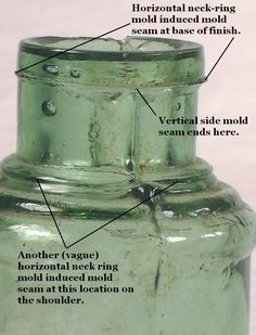 an old green glass vase with labels on the top and bottom parts labeled in english