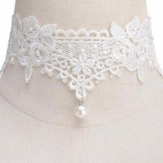 A simply lovely soft lace choker necklace featuring a dainty pearl dangle bead at the center. This choker gives a soft and romantic feel to your outfit and is really very pretty. Features an adjustable clasp closure. Vintage Adjustable Pearl Choker, Elegant Adjustable Cream Choker, Adjustable Elegant Cream Choker, Elegant Cream Adjustable Choker, White Pearl Charm Choker For Party, Adjustable Pearl Charm Choker For Party, Adjustable Lace Trim Choker, Dainty Adjustable Choker With Pearl Drop, White Pearl Drop Choker