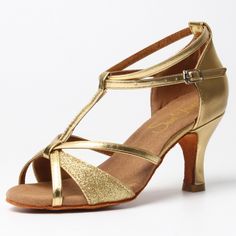 a woman's gold high heeled sandal with straps