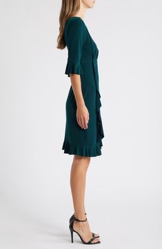 Stretch-enhanced fabric offers desk-to-dinner comfort in a dress framed by ruffled sleeves and finished with front pleats for a gathered affect. 40" length (size 8) Jewel neck Elbow-length sleeves Partially lined 100% polyester Machine wash, tumble dry Imported Elegant V-neck Pleated Dress With Ruffles, Elegant Green V-neck Ruffle Dress, Green Flutter Sleeve Evening Dress, Green Formal Dress With Pleated Sleeves, Knee-length Cocktail Dress With Ruffle Hem, Cocktail Knee-length Dress With Ruffle Hem, Fitted Midi Length Ruffle Dress For Formal Occasions, A-line Dress With Ruffle Hem For Work, Fitted Dress With Ruffle Hem For Formal Occasions