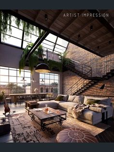 a living room filled with lots of furniture next to a staircase leading up to a loft