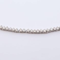 Blend fashion and sport in style with this Tennis Link Necklace. Crafted with diamond-cut links for a touch of sophistication, this timeless piece is the perfect addition to your jewelry collection. Its elegant and tasteful design is sure to make you shine. Available in 14k White Gold & 14k Yellow Gold Natural Diamonds 1.5mm | 2.1 CTW | G-H Color | SI Clarity 18" Necklace Timeless Sterling Silver Diamond Cut Tennis Necklace, Diamond Oval Link Tennis Bracelet, Cubic Zirconia Diamond Bracelet With Solid Link, Anniversary Diamond Bracelet With Solid Link Construction, Diamond Tennis Bracelet With Oval Link And Accents, Oval Link Diamond Tennis Bracelet With Accents, Luxury Diamond Bracelet With Solid Link For Anniversary, Oval Link Diamond Tennis Bracelet With Diamond Accents, Elegant White Link Jewelry