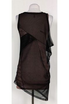 Great for day or night, this chic tank top is a versatile choice. Designed with a taupe tank top lining and an edgy mesh and lace overlay. An asymmetrical hemline tops off the garment. Size XXS Shell: 80% polyester, 20% spandex Contrast 1: 100% nylon Contrast 2: 86% lyocell, 9% wool, 5% spandex Slips on Rounded neckline Mesh & lace overlay Taupe tank lining Bust 23" Shoulder to hem 26" - tank top lining, 33"- overlay Sheer Stretch Tank Top For Night Out, Chic Black Mesh Tank Top, Elegant Sheer Tank Top For Night Out, Black Sheer Tank Top For Evening, Chic Mesh Tank Top For Party, Sheer Sleeveless Mesh Top For Night Out, Sheer Sleeveless Mesh Top For Evening, Chic Mesh Tank Top For Night Out, Sleeveless Sheer Mesh Top For Night Out