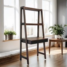 a wooden chair sitting in front of a window next to a table with potted plants