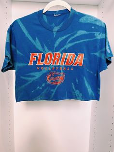 University of Florida Volleyball tie dye crop top. It best fits a women's size medium but it can fit a size small for an oversized look. It is super cute on and in great condition. Summer Acid Wash Crew Neck Crop Top, Summer Acid Wash Crop Top With Crew Neck, Acid Wash Crew Neck Crop Top For Summer, Summer Distressed Crew Neck Crop Top, Casual Tie Dye Crop Top, Tie-dye Cropped Cotton Tops, Tie Dye Cropped Top, Cropped Tie Dye Cotton Tops, Acid Wash Cropped Crop Top