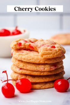 cherry cookies stacked on top of each other with cherries in the background and text overlay