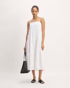 The Gauze Tiered Dress White – Everlane Casual Tiered Cotton Midi Dress, Casual Tiered Maxi Dress For Vacation, Casual Cotton Tiered Midi Dress, Casual White Maxi Dress With Tiered Skirt, Chic Relaxed Fit Midi Dress For Daytime, Casual Smocked Bodice Midi Length Tiered Dress, Summer Tiered Midi Dress For Daywear, Casual Tiered Dress With Ruffle Hem For Daywear, Chic Cotton Tiered Maxi Dress