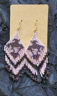 Hand-made Beaded Earrings  -Czech beads (dark & light purple, multi colored metallic) Pink Beaded Earrings With Black Beads For Gift, Pink Dangle Beaded Earrings With Black Beads, Purple Beaded Earrings With Dangling Round Beads, Purple Colorful Beaded Earrings For Festival, Festival Purple Beaded Earrings, Purple Festival Jewelry With Black Beads, Purple Jewelry With Black Beads For Festival, Adjustable Purple Beaded Earrings With Colorful Beads, Purple Beaded Dangle Earrings With Black Beads