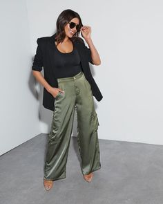 The Never Impossible Satin Cargo Pants combine the luxe look and feel of satin with the approachable, always-flattering cargo silhouette. It has a wide leg fit and pockets for anything you can think of. High rise Pocketed Wide pant leg Front zip fly & button closure 100% Polyester Silk Cargo Joggers Outfit, Outfits With Silk Pants, Green Satin Cargo Pants Outfit, Straight Leg Utility Cargo Pants, Satin Cargo Pants Outfit Dressy, Green Silk Pants Outfit, Silk Wide Leg Pants Outfit, Black Satin Cargo Pants Outfit, Wide Leg Satin Pants Outfit