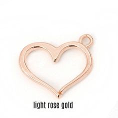 Smooth open design heart charm 16 mm (5/8 inch) x 13mm (1/2 inch). Heart charm is flat 2 mm thick with slightly curved edges. Charms are lightweight, have nice clean lines, smooth shiny finish, and are a good size for earrings, necklace or bracelet designs. Available in silver tone, gold plate, and light rose gold colors Choose color and pack size pack of 2 or 4 charms at check out. Use for jewelry, gift tie on, zipper pull, purse charm or whatever you imagine. On multiple item purchases you wil Metal Charm Necklaces With Open Heart Design, Metal Charm Necklace With Open Heart, Nickel Free Open Heart Charm Necklace For Valentine's Day, Heart Charms For Jewelry Making On Valentine's Day, Heart Charms For Jewelry Making, Heart Charms For Jewelry Making Valentine's Day, Heart Pendant Charms For Jewelry Making, Valentine's Day Heart Pendant Charms For Jewelry Making, Metal Heart Charm