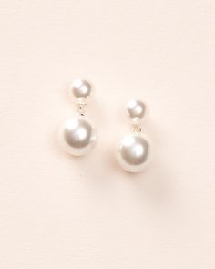 Our Nadine Pearl Dangle Earrings are simple & chic. Add a touch of elegance to any look with these earrings designed with small lustrous off white pearls accented with a larger pearl dangle. Off white, glass pearls 0.75" length Hypoallergenic, lead-free & nickel-free Earrings will match with both ivory and white gowns Style #4455 Pearl Dangle Earrings, Nickel Free Earrings, White Gowns, Free Earrings, Simple Chic, Pearl Earrings Dangle, Sparkling Crystal, Silver Earrings Dangle, Wedding Looks