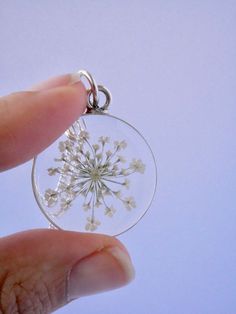 "Our Arrowhead Frame has a modern bohemian feel and is available in a variety of real preserved botanicals. Choose from 24k gold plated or .999 sterling silver plated. The Dandelion Seed symbolizes wishes. The Fern is a symbol of sincerity Forget-me-nots are known as a symbol of lasting friendship, love, and remembrance Lavender is a symbol of devotion Pendant hangs from a gold or silver plated chain, available in 26\" or 30\" lengths. Choose from plain chain or satellite chain, see picture for Dainty Round Pendant Jewelry With Flower Charm, Dainty Jewelry With Flower Charm Round Pendant, Dainty Jewelry With Round Flower Charm Pendant, Round Flower Charm Jewelry For Keepsake, Delicate Round Pendant Jewelry With Flower Charm, Delicate Jewelry With Flower Charm On Round Pendant, Round Keepsake Jewelry With Flower Charm, Nature-inspired Flower Charm Round Pendant Necklace, Nature-inspired Jewelry With Flower Charm For Anniversary