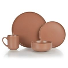 a brown dinnerware set with two cups and one saucer on the side, in front of a white background