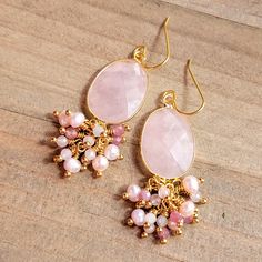 These beauties will adorn your ears with great elegance. Faceted rose quartz Facet pink Tourmaline gemstones Faceted pale blue Morganite gemstones Pink freshwater pearls 10k gold plate ear hooks 18k gold plate wire Length 2.5" Made in the USA Elegant Rose Quartz Gemstone Earrings, Elegant Teardrop Rose Quartz Earrings, Elegant Rose Quartz Drop Earrings, Rose Quartz Gemstone Dangle Earrings, Elegant Gemstone Beads Dangle Earrings, Pink Teardrop Earrings With Natural Stones, Pink Rose Quartz Earrings With Natural Stones, Elegant Dangle Earrings With Gemstone Beads, Elegant Gemstone Beads Earrings For Gift