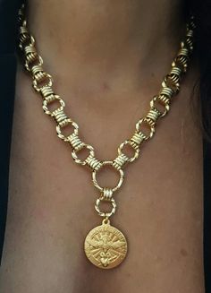 "♦ hoops links necklace, made of gold 24 K plated brass in very high quality with a coin pendant, the beautiful necklace is full of presence and suitable for any occasion. SIZA: length 13.8 inch (35 cm) up to 19.8inch ( 50 cm) wide chain 0.47\" (1.2 cm) pendant width: 1.18\" (3cm) ♦ This piece of jewelry is perfect as a gift for yourself, for a friend, wedding day, Valentine's day or a birthday. ♦ The jewel will be sent by registered mail (to some countries also includes a tracking number), more Brass Medallion Necklace With Gold Chain, Gold Brass Medallion Necklace With Gold Chain, Handmade Gold Coin Medallion Necklace, Handmade Gold Amulet Medallion Necklace, Handmade Gold Medallion Necklace Amulet, Gold Medallion Necklace With Chain, Gold Medallion Necklace With Chain Detail, Handmade Gold Medallion Coin Necklace, Gold Medallion Chain Necklace