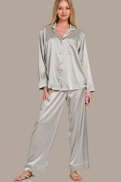 A Satin Long Sleeve Shirt and Long Pants 2 Piece Set is a stylish and versatile outfit featuring a relaxed fit and made from satin fabric for a luxurious and sleek look. The long sleeve shirt has a button-down closure at the front for easy wearing, while the pants feature an elastic waist for comfort and a perfect fit. This set is perfect for a chic and put-together outfit for various occasions. Features: Basic style Number of pieces: Two-piece Sheer: Opaque Stretch: Slightly stretchy Material c Elegant Solid Color Sleepwear With Relaxed Fit, Elegant Long Sleeve Sleepwear Set, Satin Long Sleeve Sets For Workwear, Elegant Solid Color Relaxed Fit Sleepwear, Elegant Solid Color Relaxed Fit Set, Satin Finish Long Sleeve Sleepwear For Night, Classic Long Sleeve Sleep Sets, Elegant Relaxed Fit Sleepwear Long Pants, Elegant Long Sleeve Sleepwear For Pajama Party