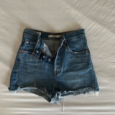 Never Worn, But Washed Once Shorts Run Extremely Small And Fit More Like A 23 Or 24 Rather Than 825 Mid-rise Bottoms With Buttons For Day Out, Chic High Rise Shorts With Button Closure, High Rise Bottoms With Buttons For Day Out, Trendy Cutoff Shorts With Buttons, High Rise Fitted Shorts With Button Closure, Medium Wash Short Bottoms With Buttons, Denim Shorts With Button Closure For Day Out, Fitted High Rise Shorts With Button Closure, Levi's Blue Bottoms With Button Closure