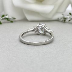 This beautiful ring is made from genuine 925 sterling silver with rhodium plating. Ring details- -The Main stone is an Oval Cut 8x6mm Simulated diamond -Side stones are 4mm by 2mm clear Marquise and 1.5mm Round simulated diamonds -Ring is casted in solid 925 sterling silver with rhodium plating (yellow gold and rose gold plated also available, please check the drop down menu for more options) -The Total face height of the ring measures 8mms and the band width measures 1.6mms -Each ring is handma Promise White Gold Topaz Ring In Sterling Silver, White Gold Sterling Silver Topaz Promise Ring, Promise Topaz Ring In White Gold Sterling Silver, Fine Jewelry Moonstone Ring With Accent Stones For Anniversary, Silver Crystal Ring With Accent Stones In Sterling Silver, Silver Sterling Crystal Ring With Accent Stones, Diamond White Sterling Silver Wedding Birthstone Ring, Diamond White Sterling Silver Birthstone Wedding Ring, Diamond White Sterling Silver Crystal Promise Ring