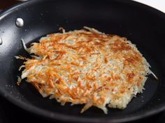 an omelet is being cooked in a skillet