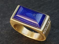 large gold lapis lazuli ring, diamond gold ring, lapis statement ring gold signet ring, engagement ring for men, future heirloom ring Luxurious, statement sized lapis lazuli and diamond ring, crafted in 14k yellow gold.  Awesome engagement ring, stunning signet ring and a unique gift for a special someone.  Great for men and women alike. Perfect for everyday wear or a special night out.  > 14k solid yellow gold > genuine blue lapis lazuli gemstone > total of 8 white diamond gems > fits a size US Engagement Ring For Men, Fire Opal Engagement Ring, Heirloom Ring, Raw Opal Ring, Heirloom Rings, Diamond Gold Ring, Faceted Ring, Fire Opal Ring, Gold Statement Ring