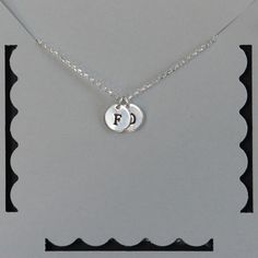 Personalized initial necklace + Sterling silver rollo chain (1.5mm) + Sterling silver disks (9mm) + Sterling silver spring clasp + 2 inch sterling silver extender * You can pick how many disks you want. Just let me know the letter(s) that you would like me to stamp on the disk(s) * Every item comes in a pretty gift box * Please contact me for custom sizes or designs Sterling Silver Initials Charm Necklace For Birthdays, Sterling Silver Initials Charm Necklace For Birthday, Sterling Silver Initial Pendant Charm Necklace For Birthday, Birthday Sterling Silver Initial Pendant Charm Necklace, Silver Charm Necklace For Mother's Day Birthday Gift, Adjustable Stamped Sterling Silver Charm Necklaces, Sterling Silver Round Charm Necklace For Birthday, Sterling Silver Round Charm Necklace Birthday Gift, Silver Charm Necklace For Birthday And Mother's Day