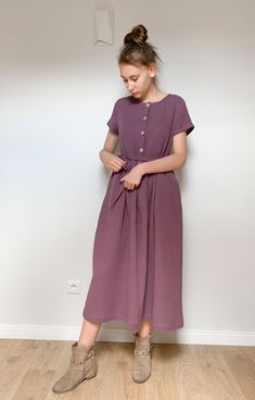 "Long dress made of high quality double gauze fabric. Front fastening with cocounut buttons. Short  sleeve. Side pockets.  Loose fit. Matching belt is added. You can buy the matching children's dress here: https://www.etsy.com/listing/1333429354/girls-double-gauze-dress-winter-moss?click_key=64835348e0c4fa9a7034d6e28e2a0f162ea83b9d%3A1333429354&click_sum=9db1b7b5&ref=shop_home_recs_14&crt=1&sts=1 XS/6-8  bust 30 1/2\"- 31 1/2\", waist 23\"-24\", hip 32 1/2\" - 33 1/2\" bust 78-80cm, waist 58-61c Linen Dress Winter, Simple Cotton Dress, Dark Wash Relaxed Fit Dress With Button Closure, Mennonite Dress Ideas, Double Gauze Dress Pattern, Double Gauze Dress, Simple Tunic Dress, Washed Blue Cotton Dress With Button Closure, Mennonite Dress