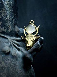 a gold ring with a bull head on it