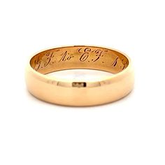 This Victorian 18 karat yellow gold wedding band captures the essence of the era with its rounded flat edge, offering a unique and elegant profile. The inside of the ring features the original wedding date engraving, adding a sentimental touch that connects to its rich history. Perfect for those who appreciate vintage beauty and historical significance, this wedding band is a testament to enduring love and tradition Platinum Rose Gold, Modern Shop, Yellow Gold Wedding Band, Sapphire Solitaire, Shop Engagement Rings, Gold Wedding Band, Gold Wedding, Vintage Beauty, Pave Diamonds