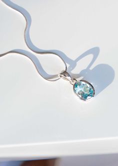 Our December birthstone necklace features a genuine Blue Topaz gemstone set in a sturdy bezel setting. Comes with sterling silver snake chain or paperclip chain to create a unique look in the length of your choice. DETAILS * Stone - 8mm x 10mm * Pendant total length 20mm * Materials - 925 sterling silver, Genuine Blue Topaz * Sterling Silver Snake Chain or Paperclip Chain S H I P P I N G * At checkout, you also have the option to choose faster shipping on the drop-down menu. We highly recommend Blue Topaz Oval Pendant Necklace As Gift, Classic Blue Topaz Gemstone Necklace, Blue Topaz Oval Pendant Necklace, Faceted Blue Topaz Blue Necklace, Light Blue Blue Topaz Pendant Necklace, December Birthstone Necklace, Gemstone Pendant Necklace, December Birthday, Blue Topaz Gemstone