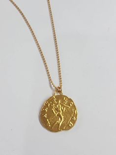 Coin pendant necklace, 14k gold necklace, antique coin necklace, gold coin necklace, gold delicate necklace, antique necklace, Roman coin This gold coin necklace was 100% handmade and has an antique Roman coin for a pendant. The necklace is 14k gold filled chain with a 14k gold plated coin pendant. It is also available in sterling silver (polished or oxidized as in the last photo). Dimensions: The 14k gold necklace is available in multiple lengths. The antique coin pendent's diameter is 1.5 cm ( Antique Gold Coin Necklace In Brass, Antique Gold Coin Pendant Medallion Necklace, Gold Medallion Coin Necklace In Brass, Antique Gold Brass Medallion Necklace With Coin Pendant, Gold Brass Medallion Coin Necklace, 14k Gold Medallion Necklace Amulet Style, 14k Gold Medallion Amulet Necklace, Brass Coin Medallion Necklace, Brass Medallion Coin Necklace