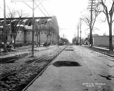 an old black and white photo of a street in the early 1900's or early 1970's