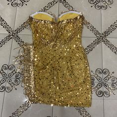 The Bodycon Dress is suitable for party. cocktail. clubbing. date night. wedding. night out. evening. birthday. dinner. celebrity and so on as you like. This Dress is sure to turn heads at any occasion!Our Style No.HT2726Custom Sequin Embroidered FabricMade in China Sleeveless Mini Dress For Gala, Gold Mini Dress For Cocktail Evening, Glamorous Gold Mini Dress For Evening, Sleeveless Sequin Mini Dress For Gala, Sleeveless Evening Dress For Gala Night Out, Sleeveless Sequin Dress For Cocktail Gala, Flirty Sleeveless Evening Dress For Party Season, Sleeveless Bodycon Dress For Prom Season Date Night, Sleeveless Mini Dress For Prom Night Out