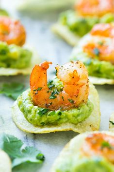 shrimp and guacamole on tortilla shells with cilantro sauce