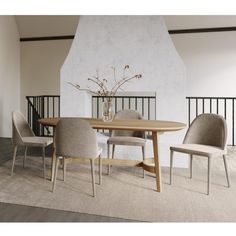 a dining room table with chairs and a vase filled with flowers on top of it