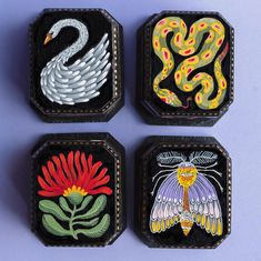 four embroidered coasters with animals and flowers in them on a purple background, one has an instagram